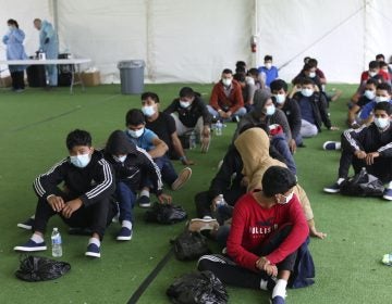 Young migrants wait to be tested for COVID-19 at the Donna Department of Homeland Security holding facility