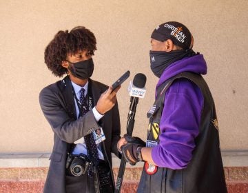 WHYY's suburban reporter Kenny Cooper conducts an interview. (Langston Collins)