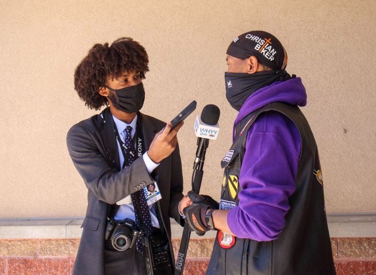 WHYY's suburban reporter Kenny Cooper conducts an interview. (Langston Collins)