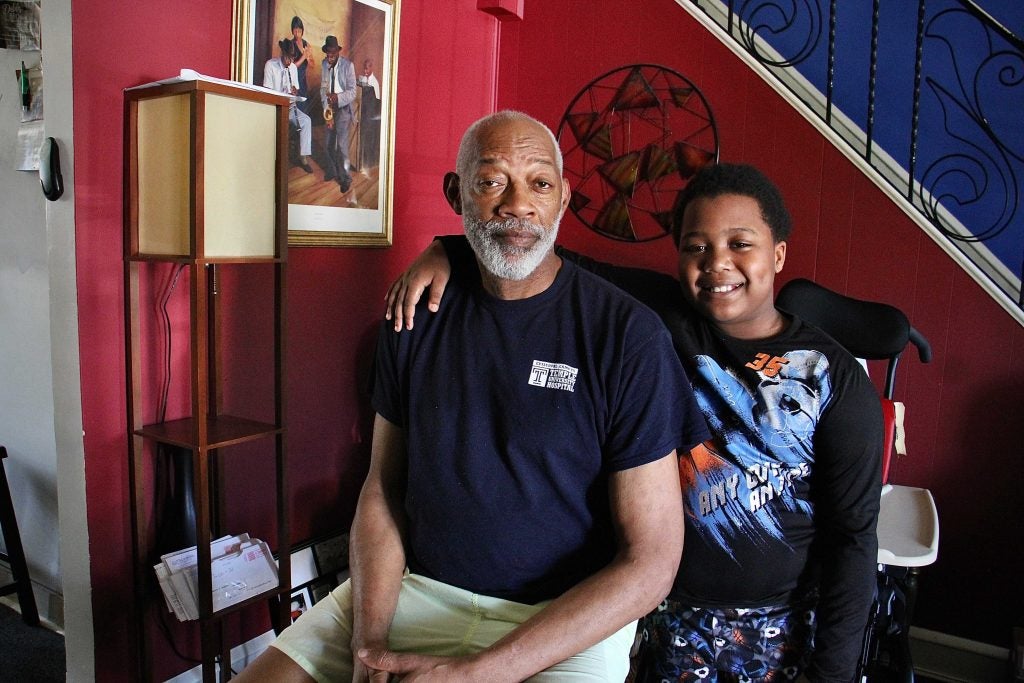 Willard McGruder, 65, of Overbrook, cares for his two grandsons, Keshawn, 8, (pictured) and Rahine, 3. (Emma Lee/WHYY)