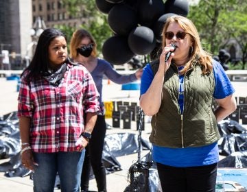 Rosalind Pichardo and Aleida Garcia stand at a rally