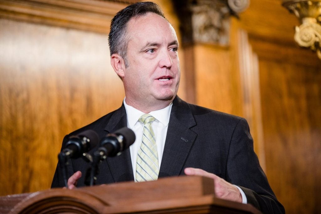 Senate President Pro Tempore Jake Corman stands at a podium