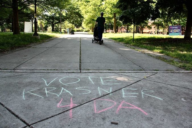 Sidewalk chalk shows support for incumbent District Attorney Larry Krasner in Jefferson Square Park