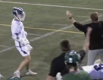 A local school district is apologizing after video captures a volunteer coach punching a player during a lacrosse game. (Screenshot)