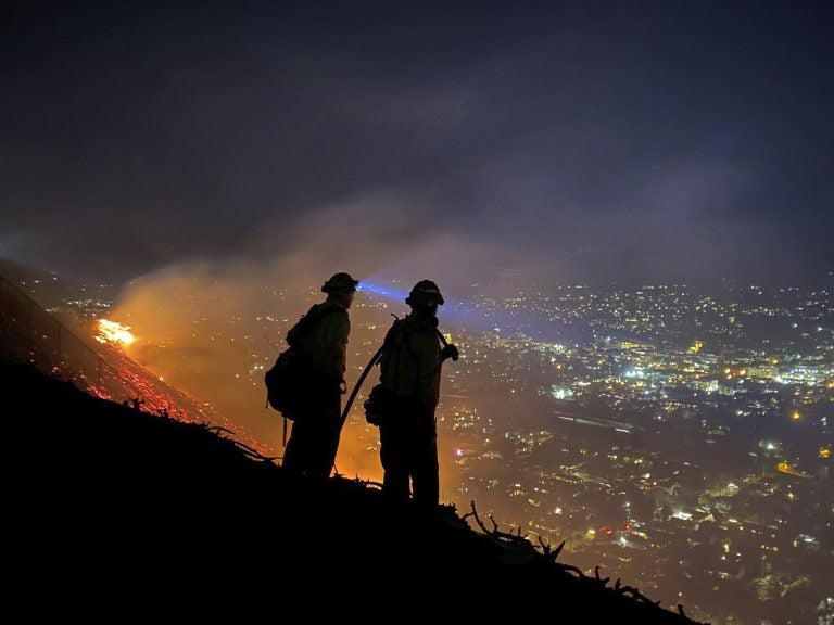 Firefighters battle a brush fire in Santa Barbara, Calif. Climate-driven droughts make large, destructive fires more likely around the world. Scientists warn that humans are on track to cause catastrophic global warming this century. (Santa Barbara County, Calif., Fire Department via AP)