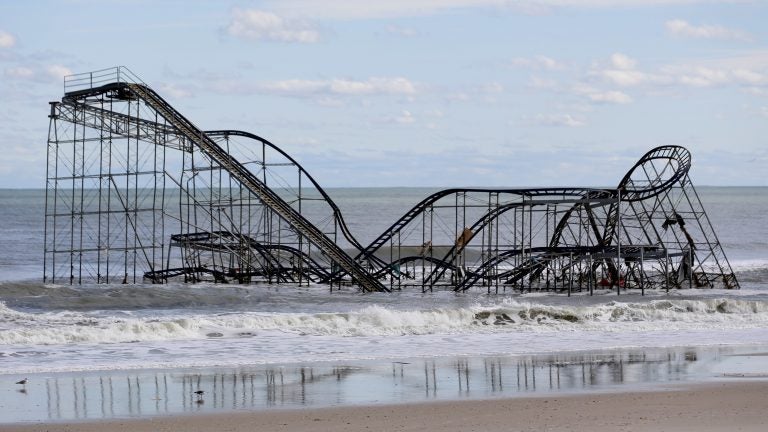 A rollercoaster that once sat on the Funtown Pier in Seaside Heights, N.J., rests in the ocean on Wednesday, Oct. 31, 2012 after the pier was washed away by superstorm Sandy. (Julio Cortez/AP)
