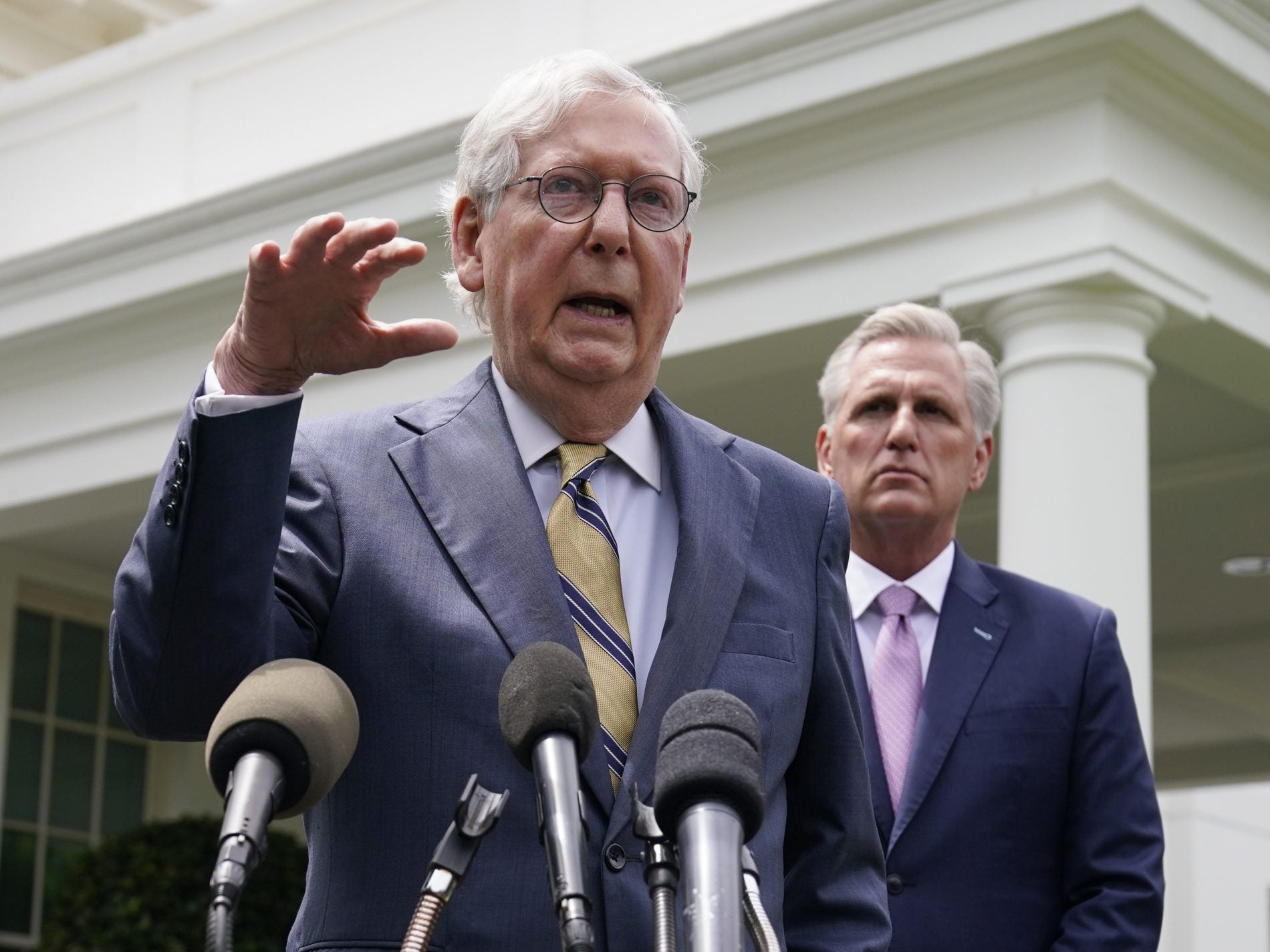 Senate Minority Leader Mitch McConnell, left, and House Minority Leader Kevin McCarthy speak to reporters outside the White House after meeting with President Biden Wednesday. (Evan Vucci/AP Photo)