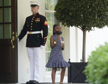 Gianna Floyd, George Floyd's daughter, walks out of the West Wing door at the White House after meeting Tuesday with President Biden and Vice President Harris. (Evan Vucci/AP Photo)