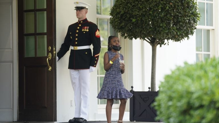 Gianna Floyd, George Floyd's daughter, walks out of the West Wing door at the White House after meeting Tuesday with President Biden and Vice President Harris. (Evan Vucci/AP Photo)