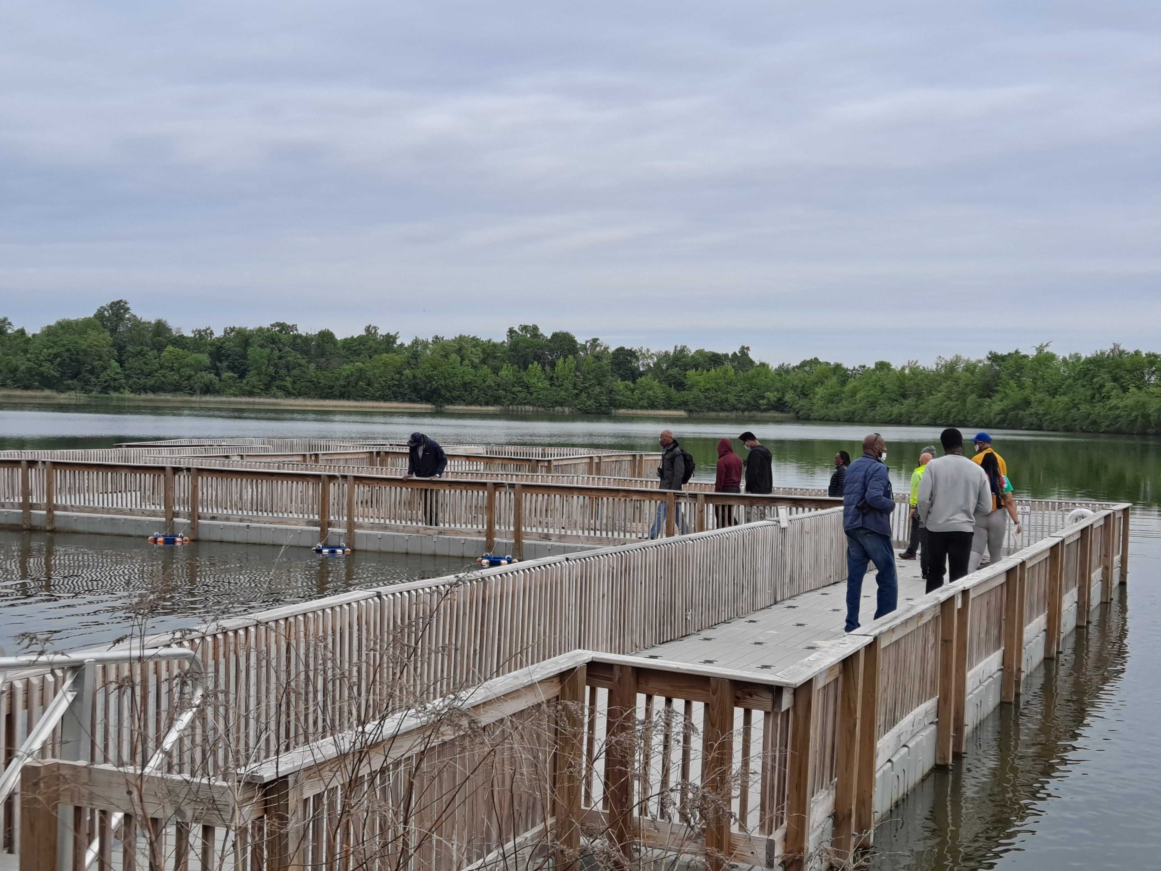 Keith Russell teaches a group about the fish at Fairmont Park