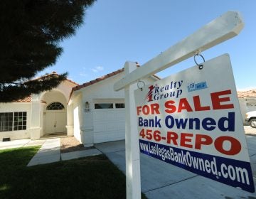 A house under foreclosure in Las Vegas displays a sign on Oct. 15, 2010, saying that it's now bank-owned. Sen. Sherrod Brown has vowed increased scrutiny of Wall Street banks, in part after a surge in foreclosures in his hometown in Ohio over a decade ago. (Mark Ralston/AFP via Getty Images)