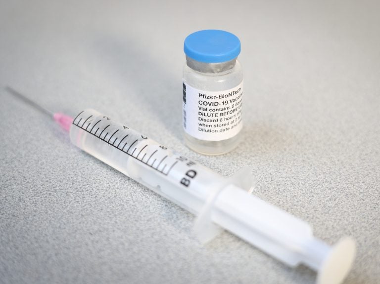 A Pfizer vaccine vial and syringe. A CDC advisory panel has recommended the Pfizer/BioNTech vaccine be administered to adolescents age 12 to 15. (Jaap Arriens/NurPhoto via Getty Images)