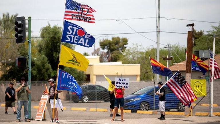 Demonstrators in support of former President Donald Trump gather on May 1 outside the Arizona Veterans Memorial Coliseum in Phoenix, where a controversial 2020 general election review was set to begin. Trump has heartily supported the audit. (Courtney Pedroza/Getty Images)