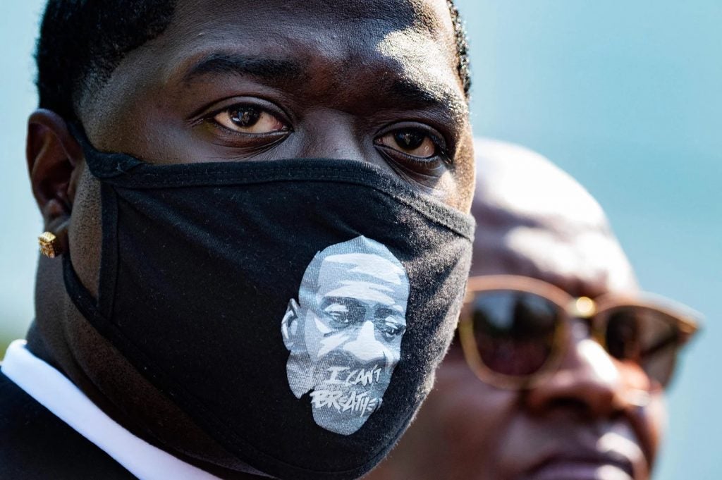 Brandon Williams, Floyd's nephew, looks on outside the White House as family members speak with reporters Tuesday after the meeting. (Jim Watson/AFP via Getty Images)