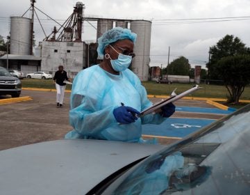 Medical workers with Delta Health Center prepare to vaccinate people in Leland, Miss., last week.