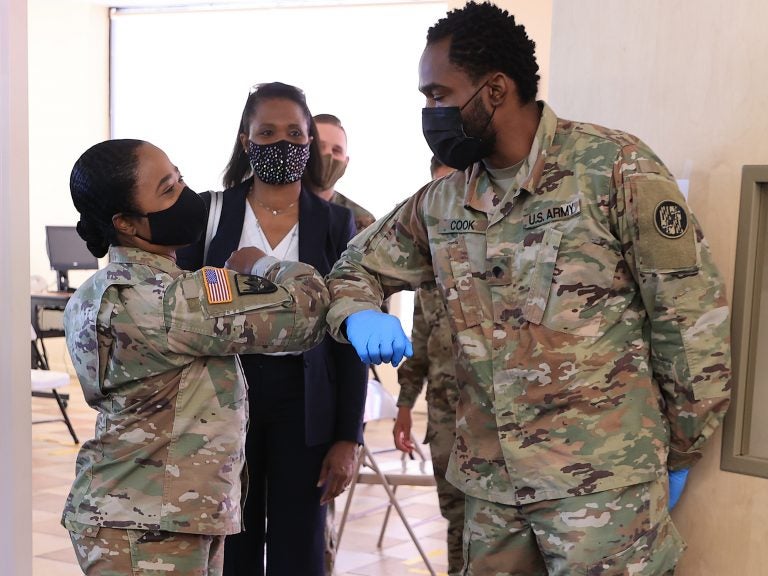 Nearly 130 million U.S. adults have completed their vaccine regimens, the CDC says, with another 70 million vaccine doses currently in the distribution pipeline. Here, Maryland National Guard Brig. Gen. Janeen Birckhead greets soldiers last week at a mobile vaccine clinic in Wheaton, Md. Nearly 130 million U.S. adults have completed their vaccine regimens, the CDC says, with another 70 million vaccine doses currently in the distribution pipeline. Here, Maryland National Guard Brig. Gene. Janeen Birckhead greets soldiers at a mobile vaccine clinic in Wheaton, Md. (Chip Somodevilla/Getty Images)