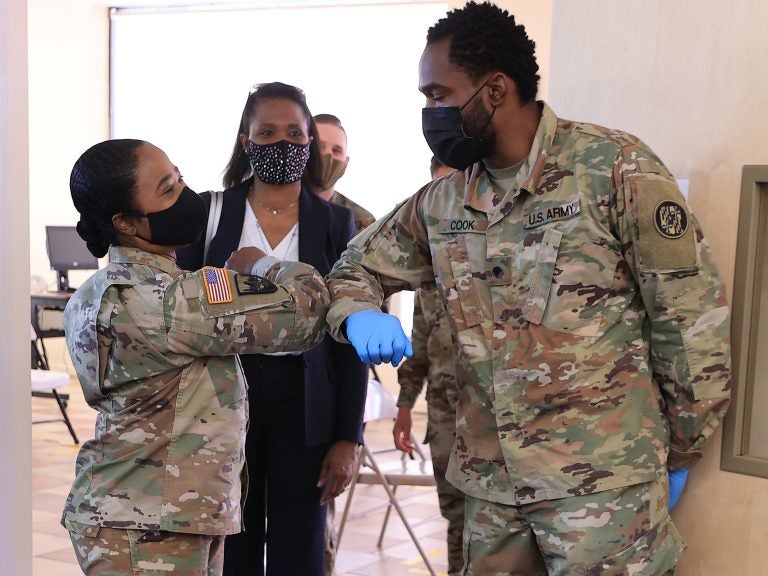 Nearly 130 million U.S. adults have completed their vaccine regimens, the CDC says, with another 70 million vaccine doses currently in the distribution pipeline. Here, Maryland National Guard Brig. Gene. Janeen Birckhead greets soldiers at a mobile vaccine clinic in Wheaton, Md. (Chip Somodevilla/Getty Images)