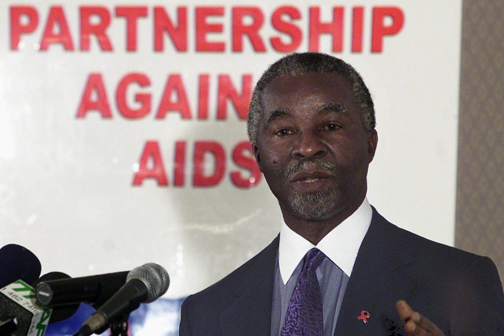 South African president Thabo Mbeki speaks to scientists from a mic