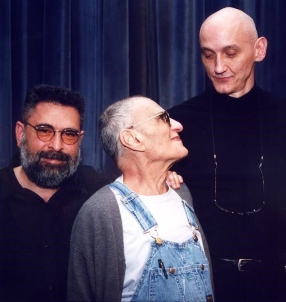 Mass, Larry Kramer, and Rodger McFarlane stand together