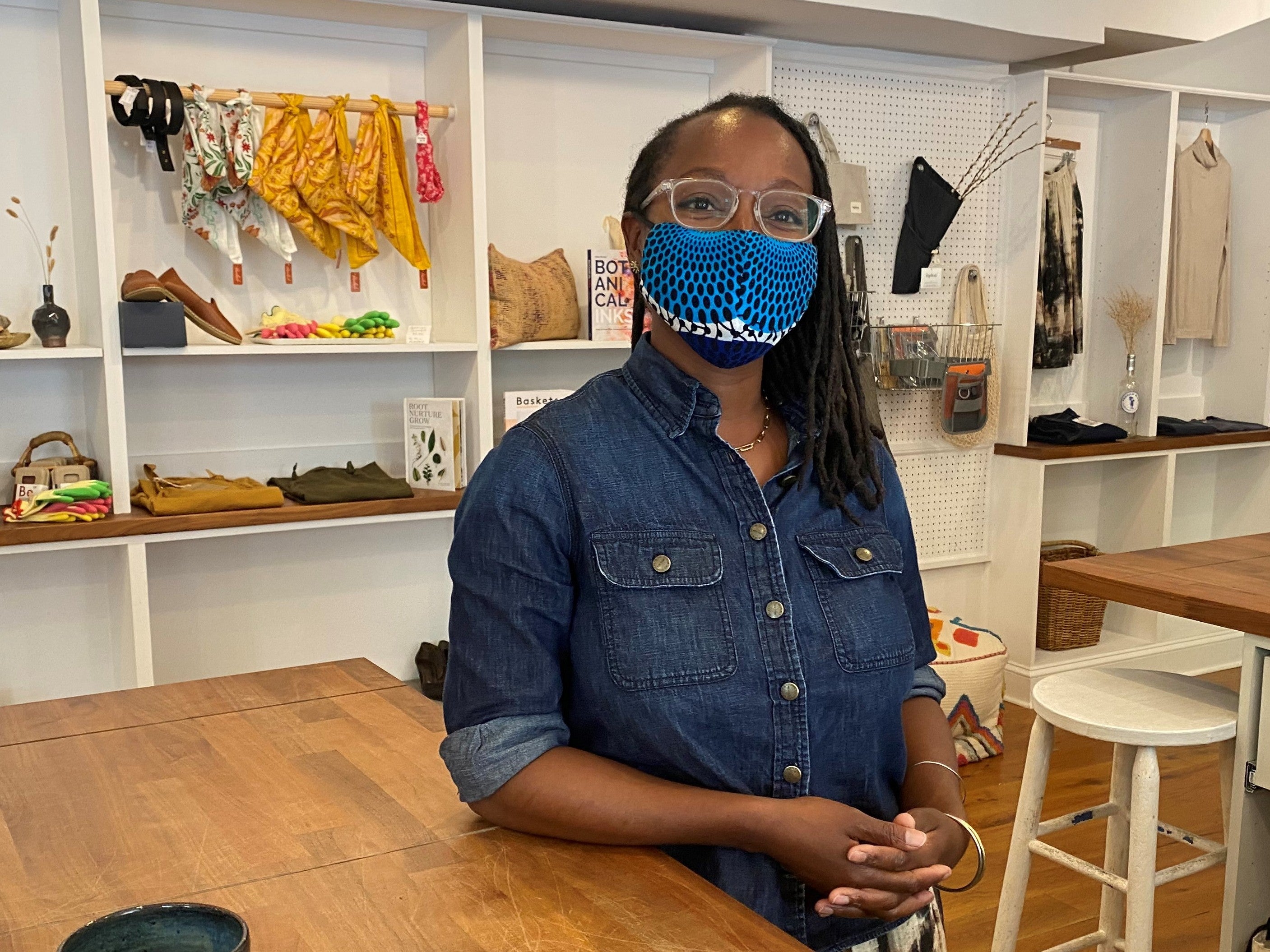 Nicole McGrew wears a mask inside a shop