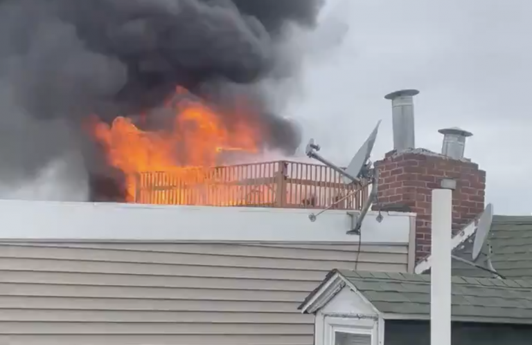 A fire is seen from the roof of a Northern Liberties home