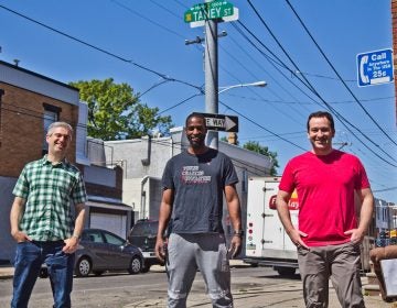 Ben Keys (left), Tyrique Glasgow (center), and Joshua Isserman (right), stand at the intersection of Tasker and Taney streets