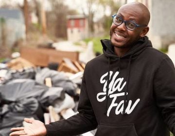 Terrill Haigler gestures while wearing a sweatshirt that says 