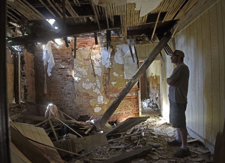 Patrick Duff, who has been fighting to save the house at 753 Walnut Street in Camden where Martin Luther King lived in 1950, inside the structure on June 10, 2021. (Photo by April Saul for WHYY)