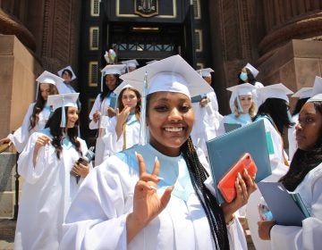 Members of John W. Hallahan Catholic Girls’ High School Class of '21, the school's last class, leave the Basilica of Saints Peter and Paul after their graduation ceremony. (Emma Lee/WHYY)