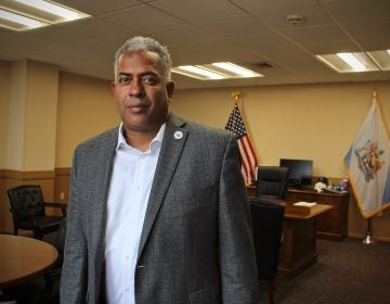 Mayor Vic Carstarphen stands inside his office