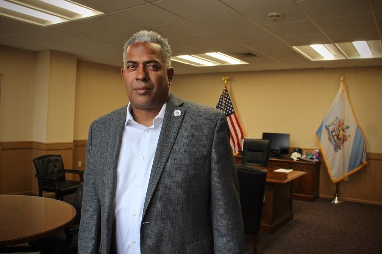 Mayor Vic Carstarphen stands inside his office