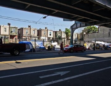 Tents set up by people experiencing homelessness along Kensington Avenue in Philadelphia’s Kensington neighborhood on the morning of June 16, 2021. (Kimberly Paynter/WHYY)