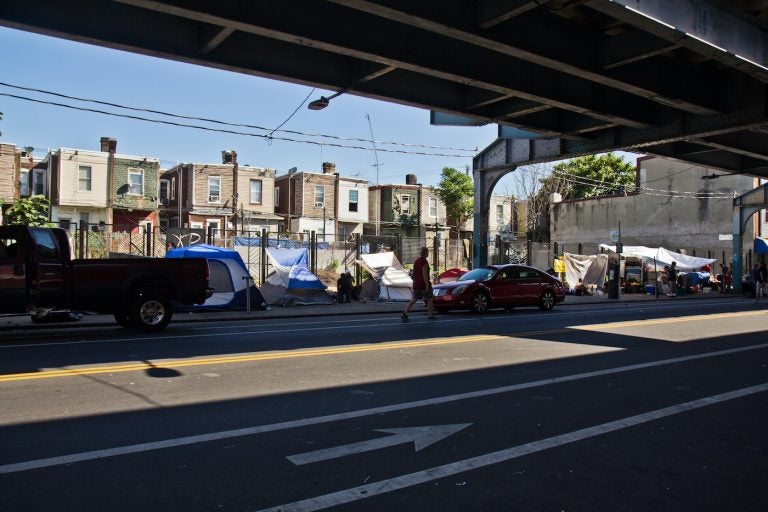Tents set up by people experiencing homelessness along Kensington Avenue in Philadelphia’s Kensington neighborhood on the morning of June 16, 2021. (Kimberly Paynter/WHYY)