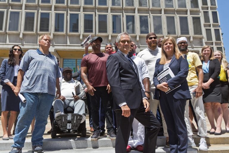 Philadelphia District Attorney Larry Krasner, the office’s CIU (Conviction Integrity Unit), and exonerees stood at the site of the statue of former Philadelphia Mayor Frank Rizzo, which was removed from Thomas Paine Plaza last year, calling the release of a report on wrongful convictions in the city on June 15, 2021, “an end of an era.” (Kimberly Paynter/WHYY)