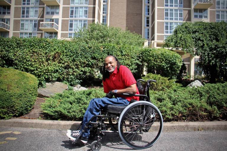 Charles Horton sits in a wheelchair outside
