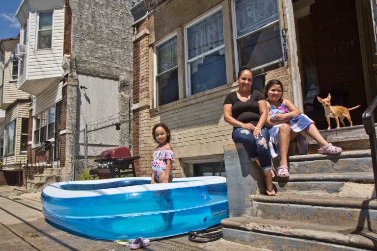Jassy Perez has lived in the Hunting Park section of Philadelphia for over 30 years. She used to take her kids, Juliani Morell, 6, and Zeahani Morell, 10,  to the neighborhood pool twice a week. (Kimberly Paynter/WHYY)