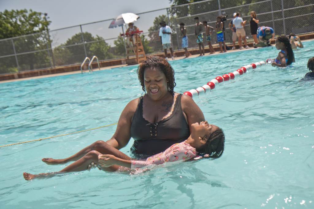 Kids and adults swim at the James Finnegan Playground pool