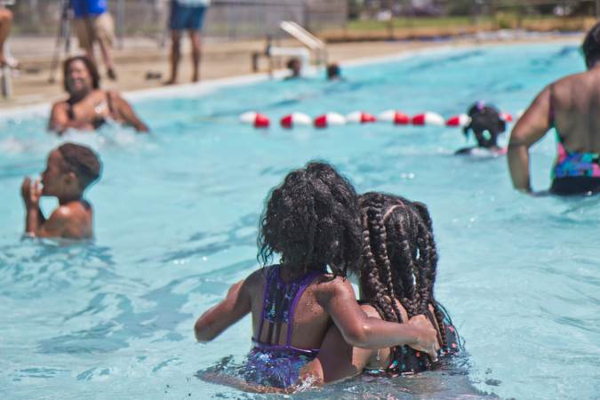 Kids swim at the James Finnegan Playground pool