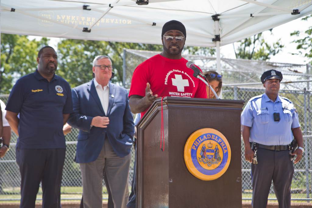 Will Coleman speaks from a podium