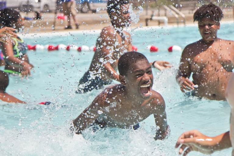 Kids swim at the James Finnegan Playground pool