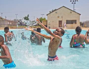 Kids swim at the James Finnegan Playground pool