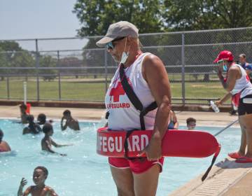 Lifeguards keep an eye on swimmers at a Philly pool