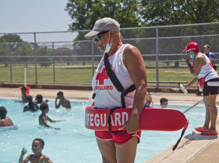 Lifeguards keep an eye on swimmers at a Philly pool