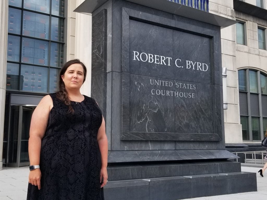 Courtney Hessler stands outside a courthouse