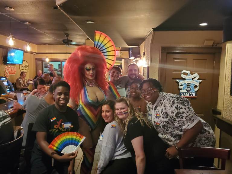 Pride Night at 2312 Garrett Bar in Upper Darby, 2021. It was the first Pride related event hosted by U.D.T.J. Bottom row from left to right: Elijah Neal, Ashely Rose, Valentina Kariouk, Dyamond Gibbs, BJ Bryant. 
Top row, left to right: Ophelia Hotass, Kyle McIntyre, name unknown. Minus Ophelia, the other people are the organizers of the Pride Festival and members of UDTJ. (Courtesy of UDTJ)