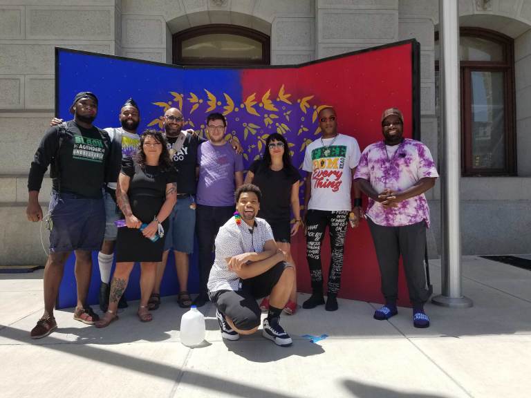 Members of ad hoc group reimagining a new Pride in Philly. L - R: Maso Kibble, Diamond Anthony, Jessica Kallup, Manny Frank-Lampon, Rich Frank-Lampon, André Henson aka Alzei Barbei Mizrahi, Elicia Gonzales, Jamaal Henderson, and Abdul-Aliy Muhammad. (Peter Crimmins / WHYY)