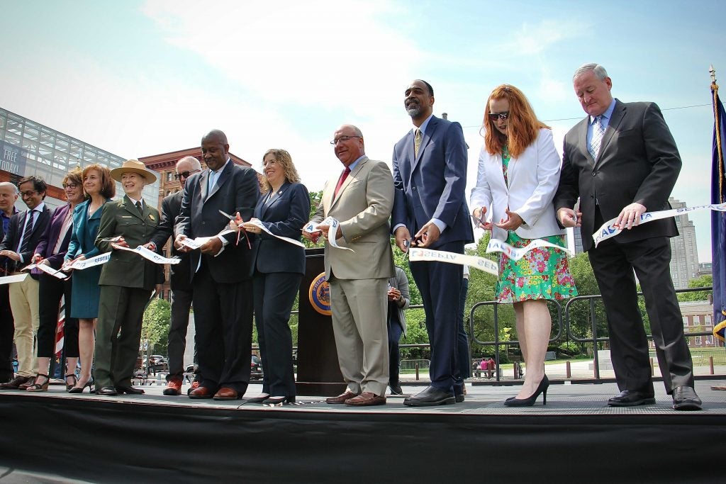 Philadelphia Mayor Jim Kenney (right) joins SEPTA officials and state and local leaders to cut the ribbon officially opening the refurbished Independence subway stop