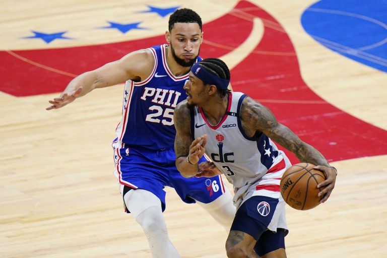 Washington Wizards' Bradley Beal, right, tries to get past Philadelphia 76ers' Ben Simmons during the second half of Game 5 in a first-round NBA basketball playoff series, Wednesday, June 2, 2021, in Philadelphia. (AP Photo/Matt Slocum)