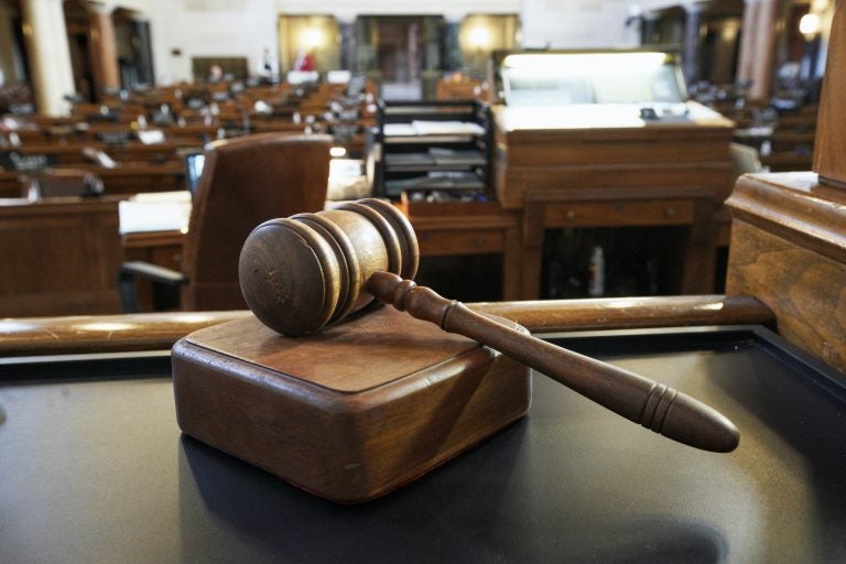 A closeup of a gavel inside a court room