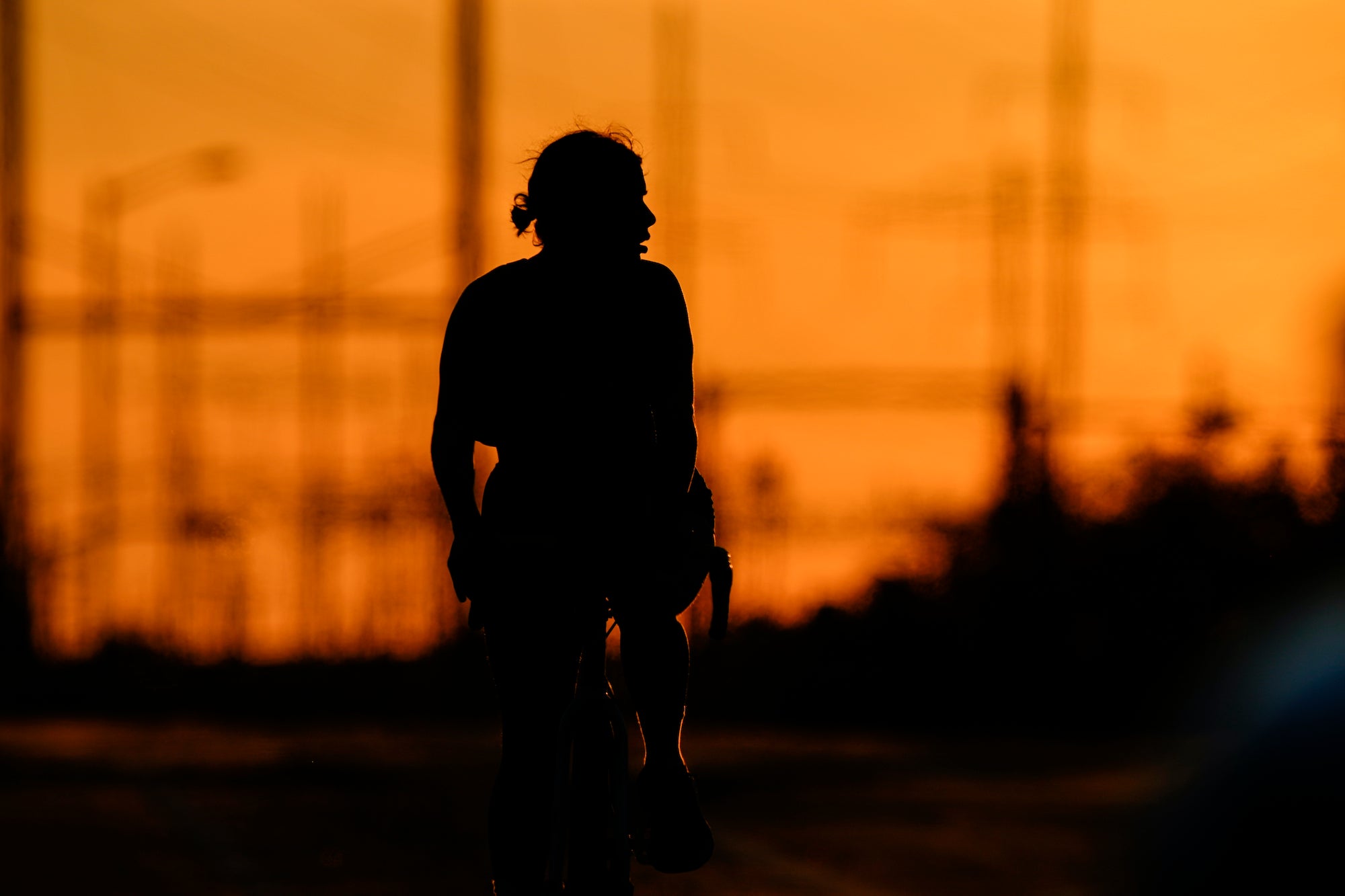 https://whyy.org/wp-content/uploads/2021/06/AP_philly_daily_summer_heat_sunset_cyclist_062921.jpg